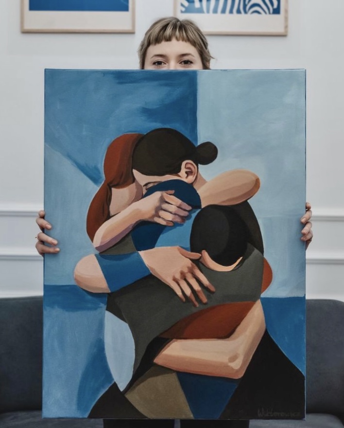 Figurative blue painting showing three people in an embrace